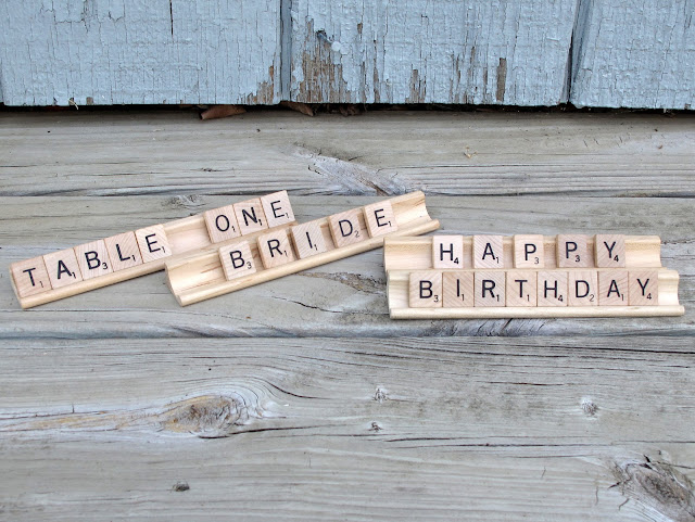 Scrabble tiles, $0.10 each, and display stands, $0.50 each, available for rent from www.momentarilyyours.com.