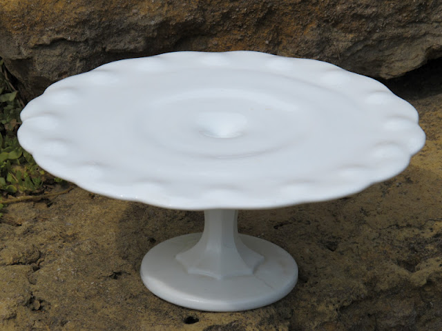 Milk Glass Teardrop Cake Stand from the rental inventory of www.momentarilyyours.com