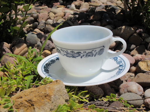 Old Town Blue Pyrex pattern china teacups & saucers available for rent from www.momentarilyyours.com, teacups for $0.75 each, saucers for $0.50 each.