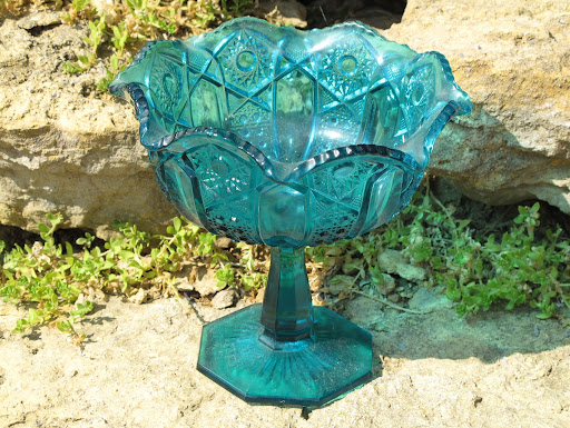 Large aqua blue pedestal bowls in assorted patterns available for rent from www.momentarilyyours.com, $2 each.