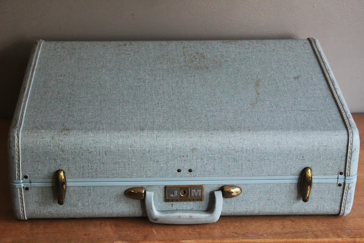 Large blue suitcase available for rent from www.momentarilyyours.com, $5.