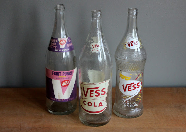 Large clear soda bottles available for rent from www.momentarilyyours.com, $2.00 each.