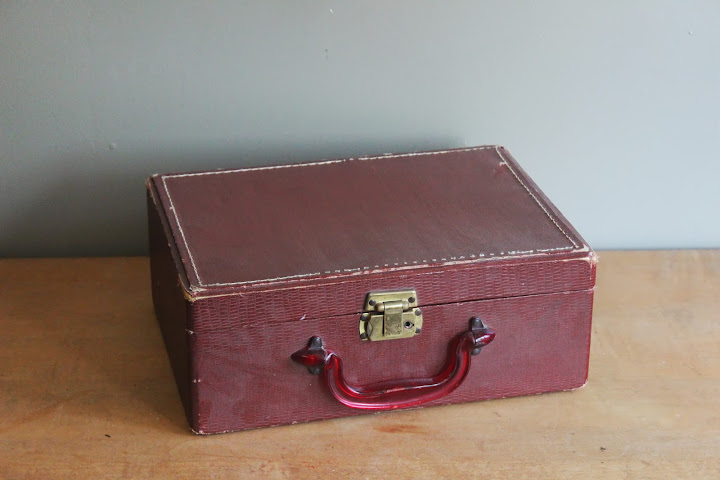 Small red suitcase available for rent from www.momentarilyyours.com, $3.