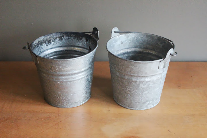 Small metal pails available for rent from www.momentarilyyours.com, $1 each.