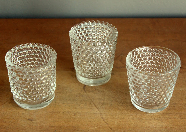 Clear hobnail votives from the rental inventory of www.momentarilyyours.com, $1.00 each.