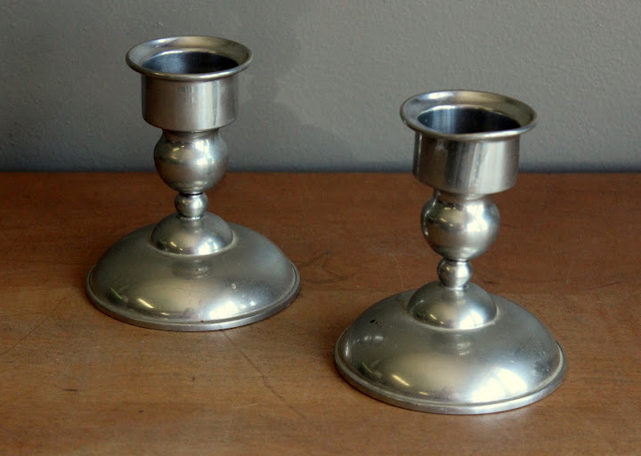 Silver taper holders from the rental inventory of www.momentarilyyours.com