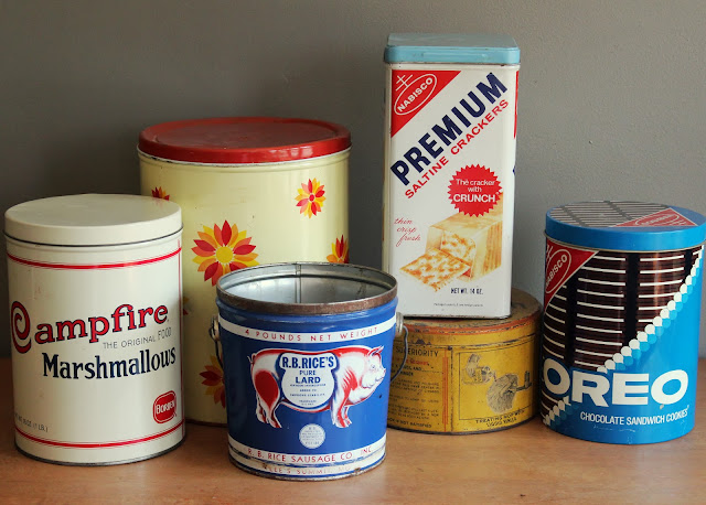 Assorted large tins available for rent from www.momentarilyyours.com, $4.00 each.
