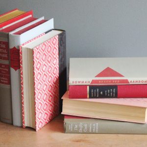 Assorted Red Hardcover Books